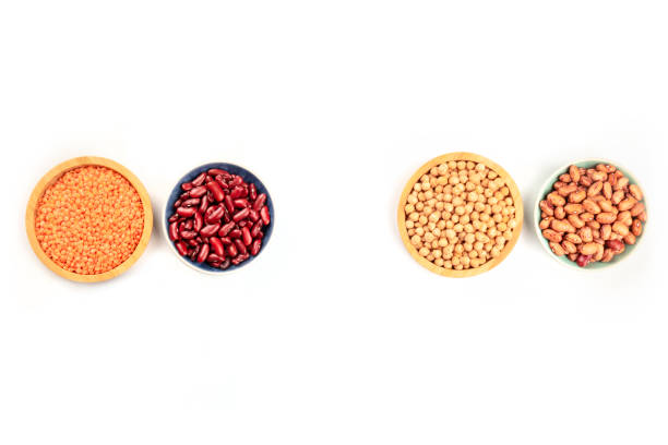 istock Various types of pulses, shot from above on a white background with copy space. Kidney and pinto beans, lentils, and chickpeas 1074808980