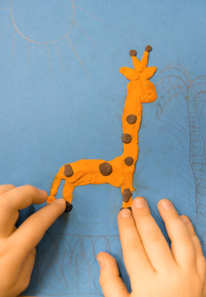istock Make a doll of clay. 1074822722