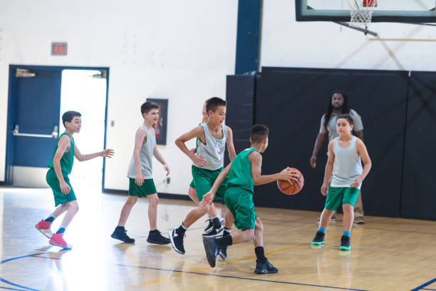 istock Elementary boys basketball scrimmage 1074823270