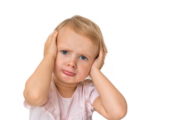 istock Little baby with sad expression in face 1074826164