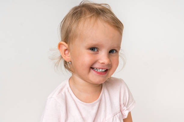 istock Beautiful smiling baby on isolated background 1074826424