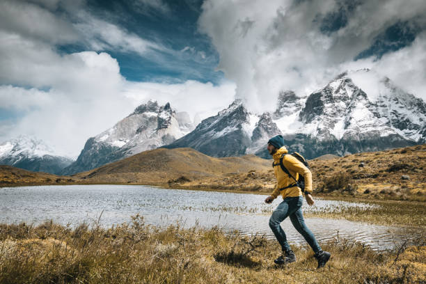 man hiking at torres del paine - chile