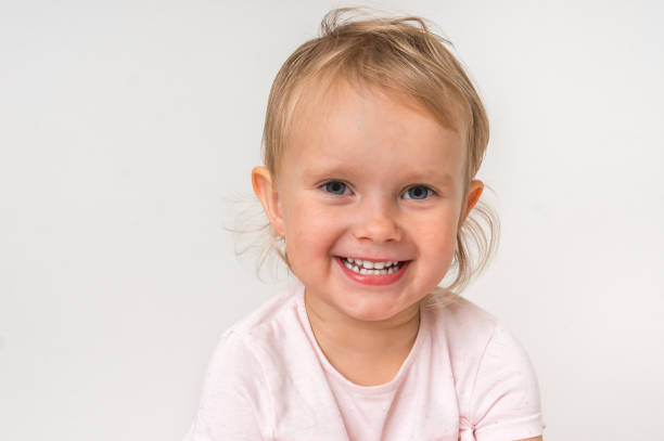 istock Beautiful smiling baby on isolated background 1074826618