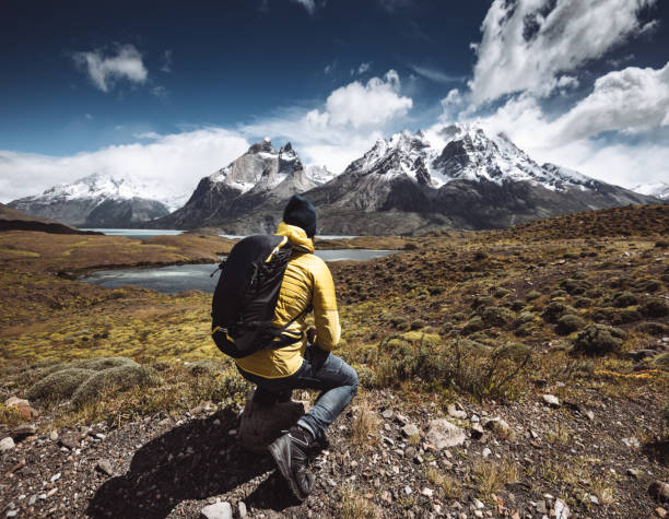 istock man hiking at torres del paine - chile 1074826766