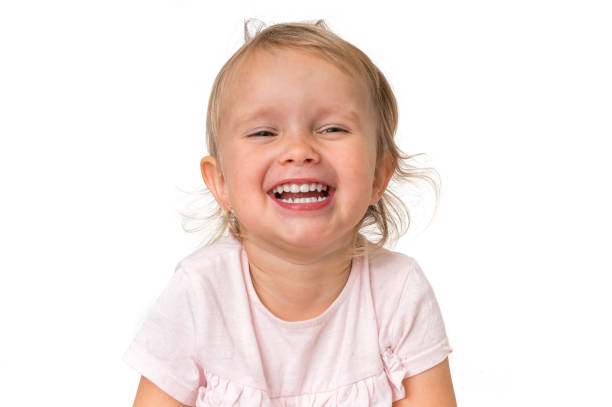 istock Beautiful smiling baby isolated on white background 1074826870