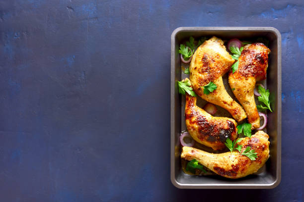 istock Grilled chicken legs in baking tray 1074829392