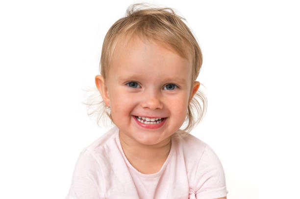 istock Beautiful smiling baby isolated on white background 1074829468