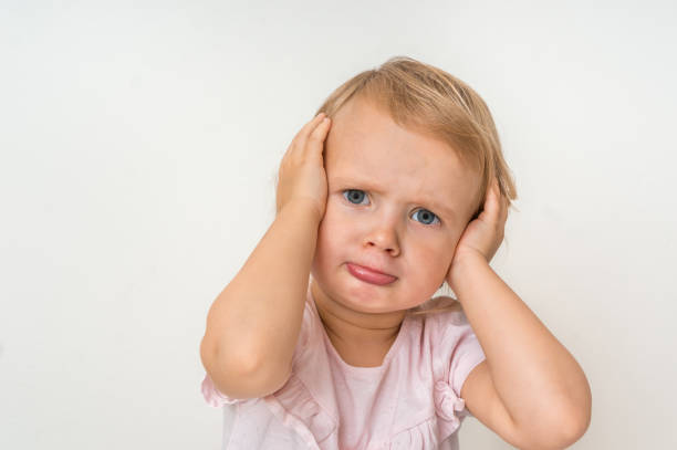 istock Little baby with sad expression in face 1074829604