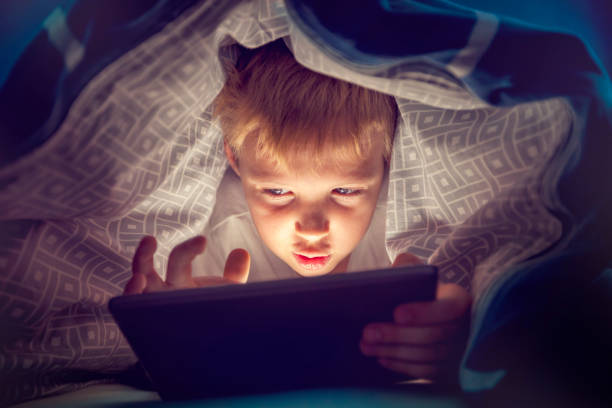 istock Boy watching a movie on a digital tablet 1074829692