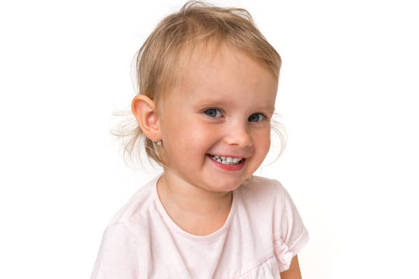 istock Beautiful smiling baby isolated on white background 1074829808