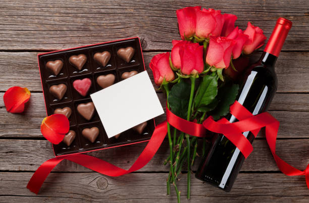 istock Red roses, wine bottle and chocolate box 1074830648