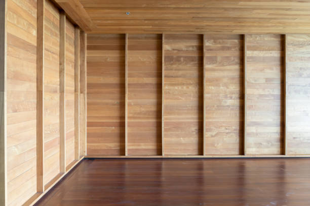 istock Corner of empty room. wooden walls and flooring, interior design elements 1074830824