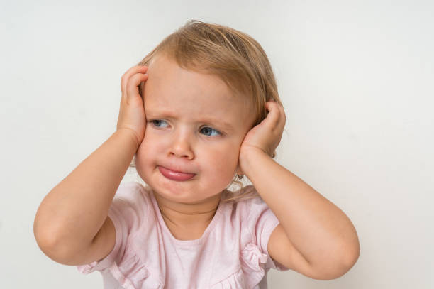 istock Little baby with sad expression in face 1074831032