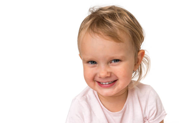 istock Beautiful smiling baby isolated on white background 1074831102