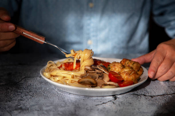 istock meat ball and mushroom spaghetti 1074833730