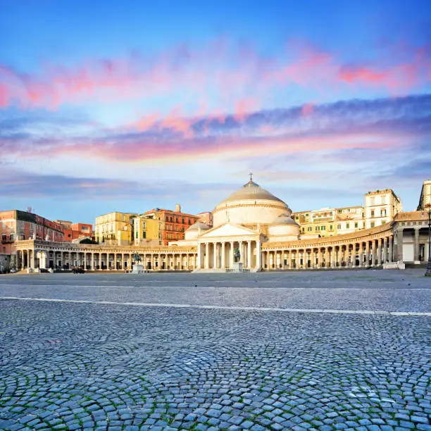 Piazza del Plebiscito in Naples at sunrise, Italy. Composite photo