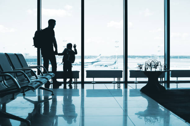 istock Father and son at the airport 1074837600