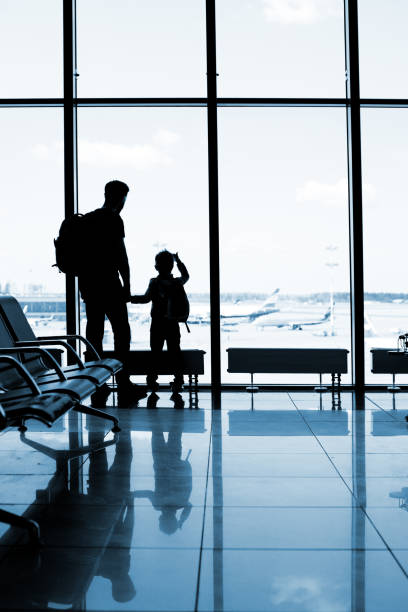 istock Father and son at the airport 1074837604
