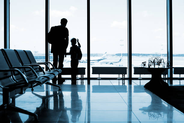 istock Father and son at the airport 1074837608