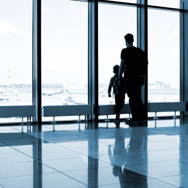istock Father and son at the airport 1074837616