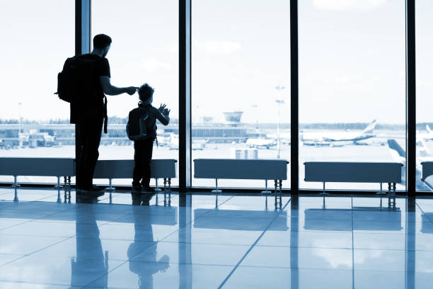 istock Father and son at the airport 1074837638