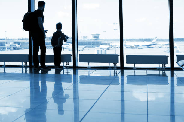 istock Father and son at the airport 1074837644