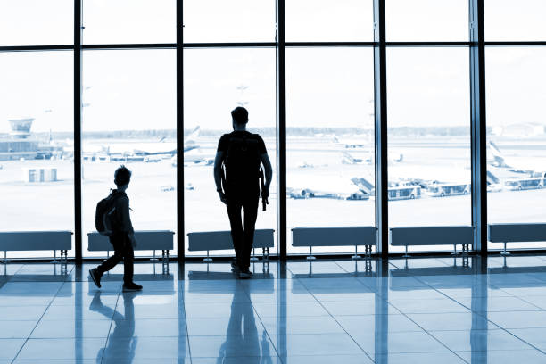 istock Father and son at the airport 1074837654