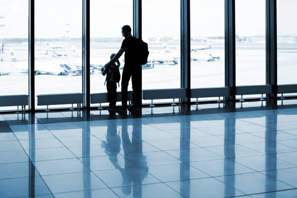 istock Father and son at the airport 1074837656