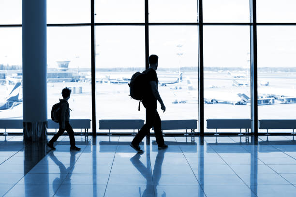 istock Father and son at the airport 1074837666