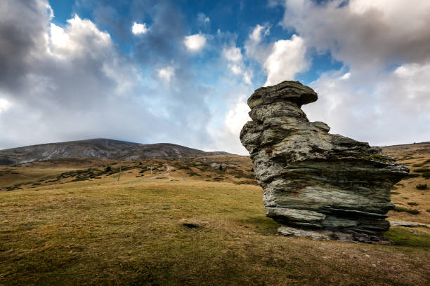 Sar Mountains - Sar Planina, Macedonia rock formation and grassy landscape under a  \n\nCloudy Sky