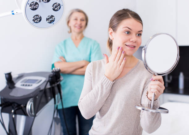 istock Smiling woman after cosmetological procedure 1074839220