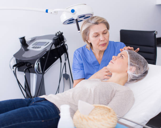 istock Cosmetologist consulting young woman 1074839238