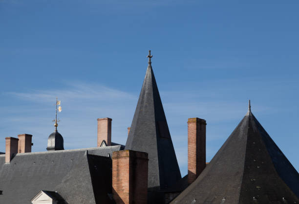 traditional france facade and roof in the city on Nantes in a sunny day with clear sky traditional france facade and roof in the city on Nantes in a sunny day with clear sky - body copy interior of old house garret stock pictures, royalty-free photos & images