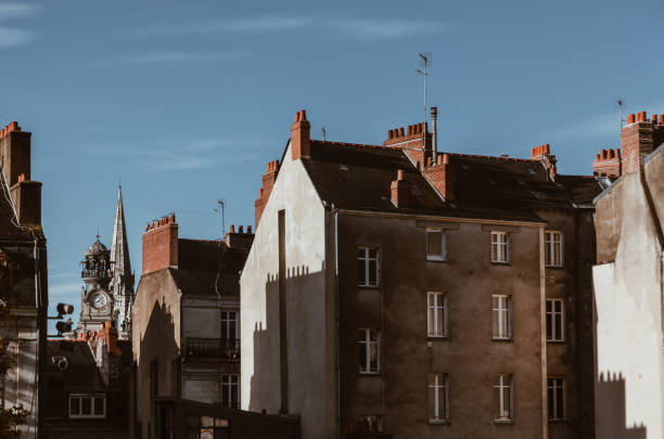 traditional france facade and roof in the city on Nantes in a sunny day with clear sky traditional france facade and roof in the city on Nantes in a sunny day with clear sky - body copy interior of old house garret stock pictures, royalty-free photos & images