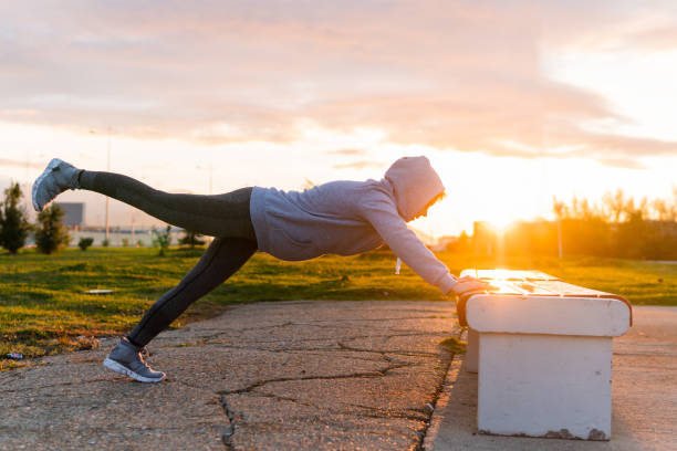 istock Works stretching. The athlete warms up the muscles before training. 1074839612