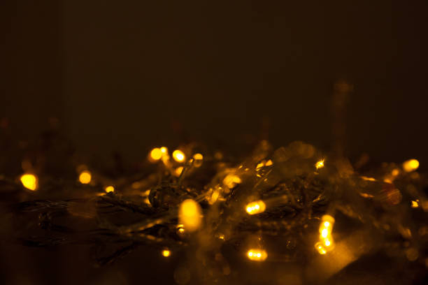 istock electric colored garland shine on black surface 1074840126