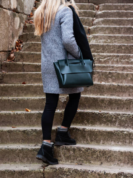 istock Girl with a green leather bag 1074842196