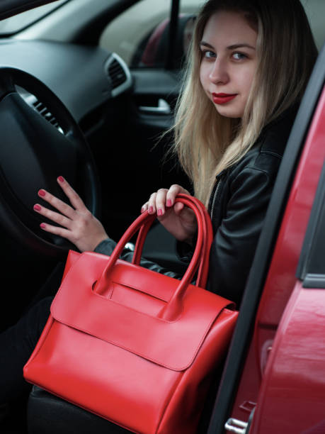 istock Girl with a red leather bag 1074842204