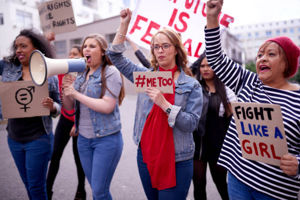 All women should take part, we are all part of this Cropped shot of women protesting in the city womens rights photos stock pictures, royalty-free photos & images