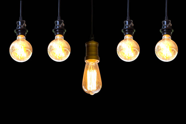 istock Vintage light bulb hanging over black background, Idea concept. 1074842644