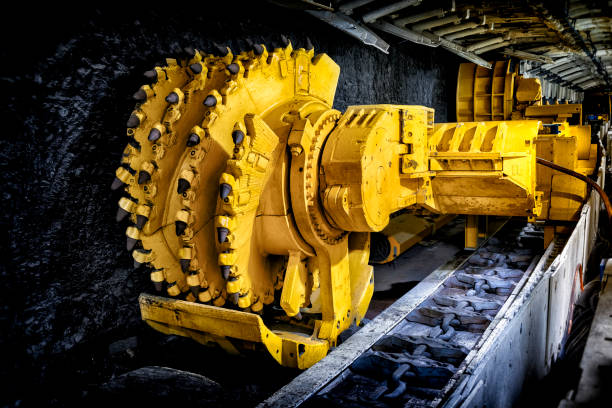 Hard coal mine underground corridor with support system and drilling machine Hard coal mine underground corridor with support system and drilling machine, Bochum, Germany mining equipment stock pictures, royalty-free photos & images