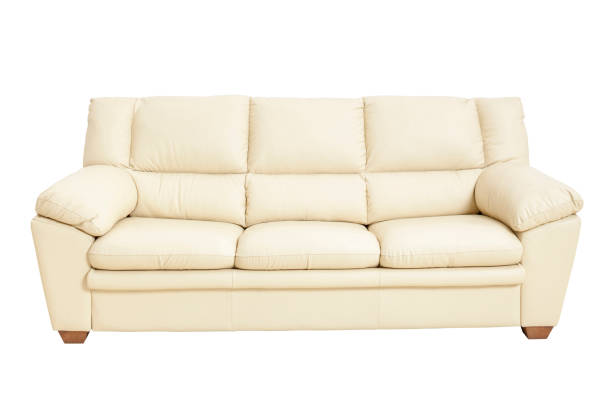 istock Three seats cozy leather sofa in nice champagne color, isolated on white. 1074847212