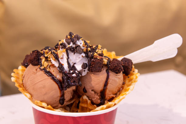 istock Chocolate ice cream in the red cup on the table. 1074850076
