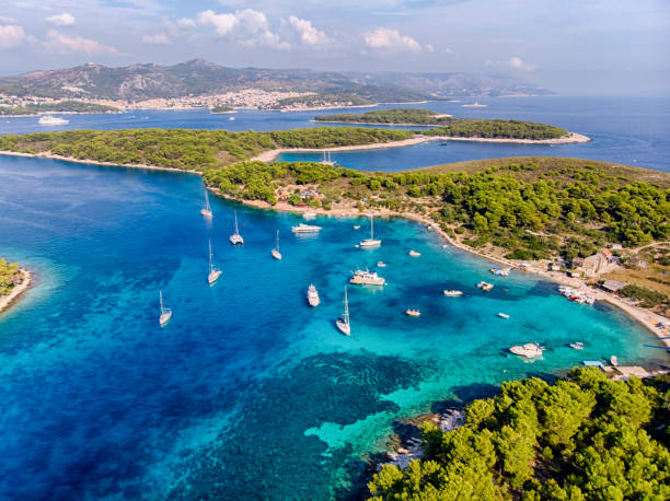 Plakinski Islands Aerial View in a sunny day Aerial view of the islands close to Hvar with boats at the water hvar photos stock pictures, royalty-free photos & images