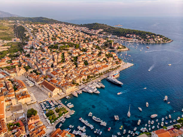 Hvar city harbor at sunset light Aerial view of Hvar city Harbor with lot of boat hvar photos stock pictures, royalty-free photos & images