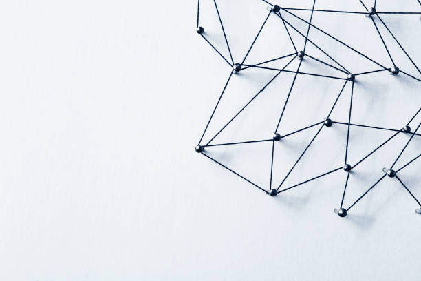 istock Linking entities. Network, networking, social media, internet communication abstract. A small network connected to a larger network. in paper linked together by cotton with a black tint 1074856718