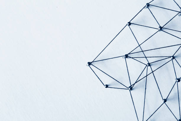 istock Linking entities. Network, networking, social media, internet communication abstract. A small network connected to a larger network. in paper linked together by cotton with a black tint 1074859454