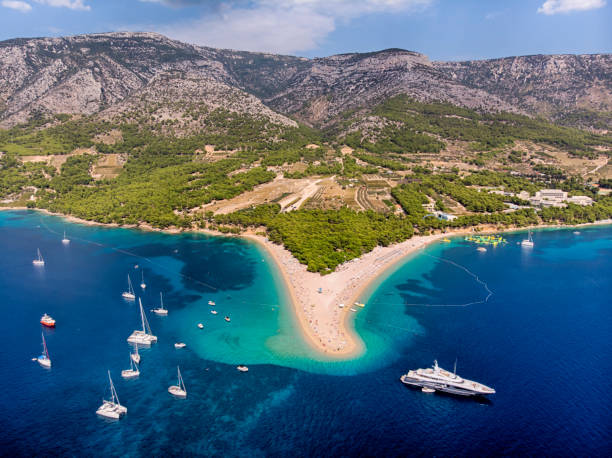 Zlatni Rat Beach in Bol, Island of Brac Aerial view of Zlatni Rat Beach in Brac Island, Dalmatian Region brac island stock pictures, royalty-free photos & images