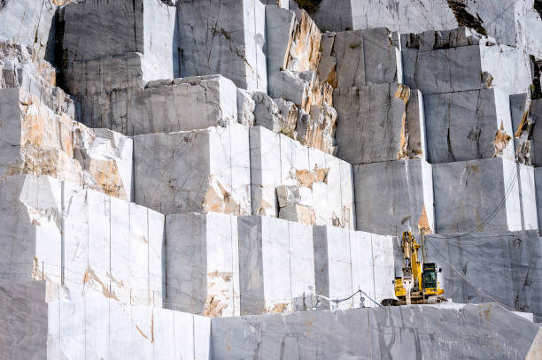 Marble quarry in Carrara, Tuscany, Italy The quarries are places where excavation and marble processing takes place for many centuries. quarry stock pictures, royalty-free photos & images