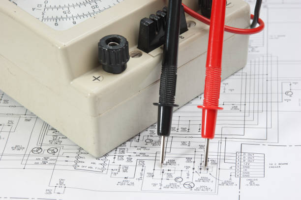 istock Old multimeter on the wiring diagram 1074862782